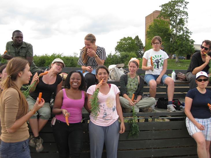 TH -WSFC Summer School's group eating Swiss carrots fresh picked from the field!